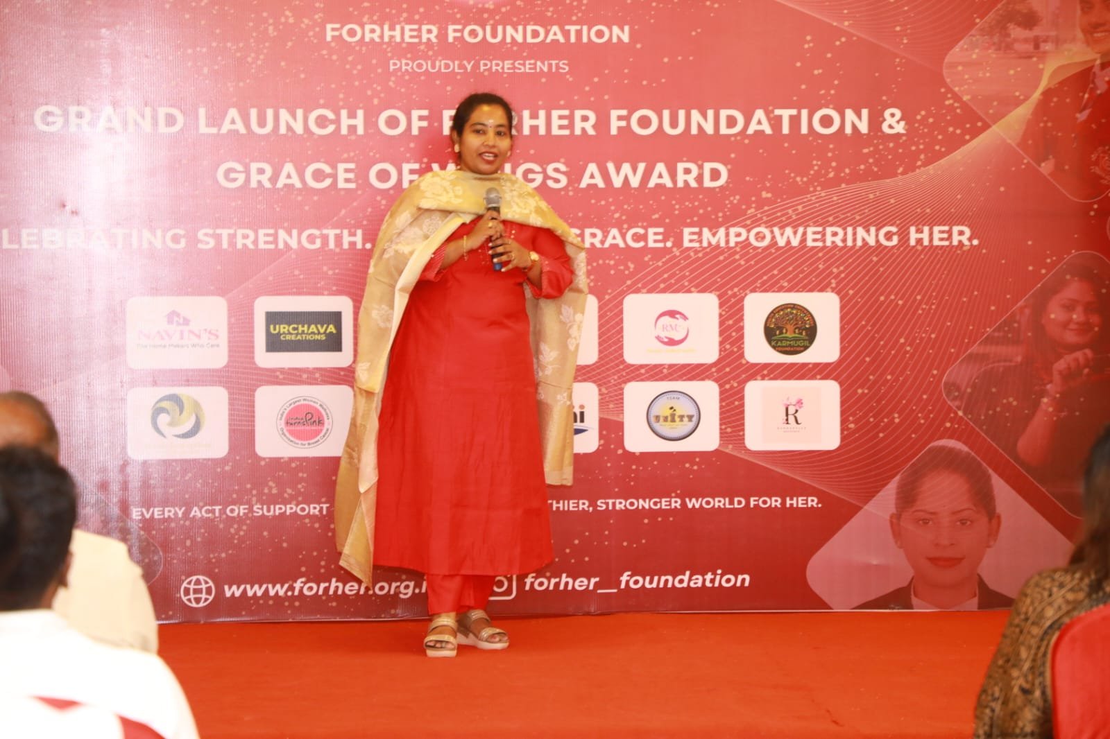 Founder addressing the audience at the Grand Launch of FORHER Foundation